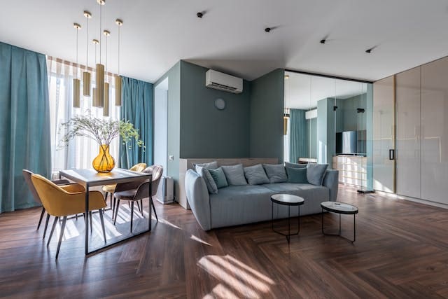a living room mostly with a grey-blue theme