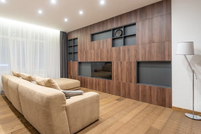 living-room-with-light-brown-couch-facing-a-flat-screen-tv